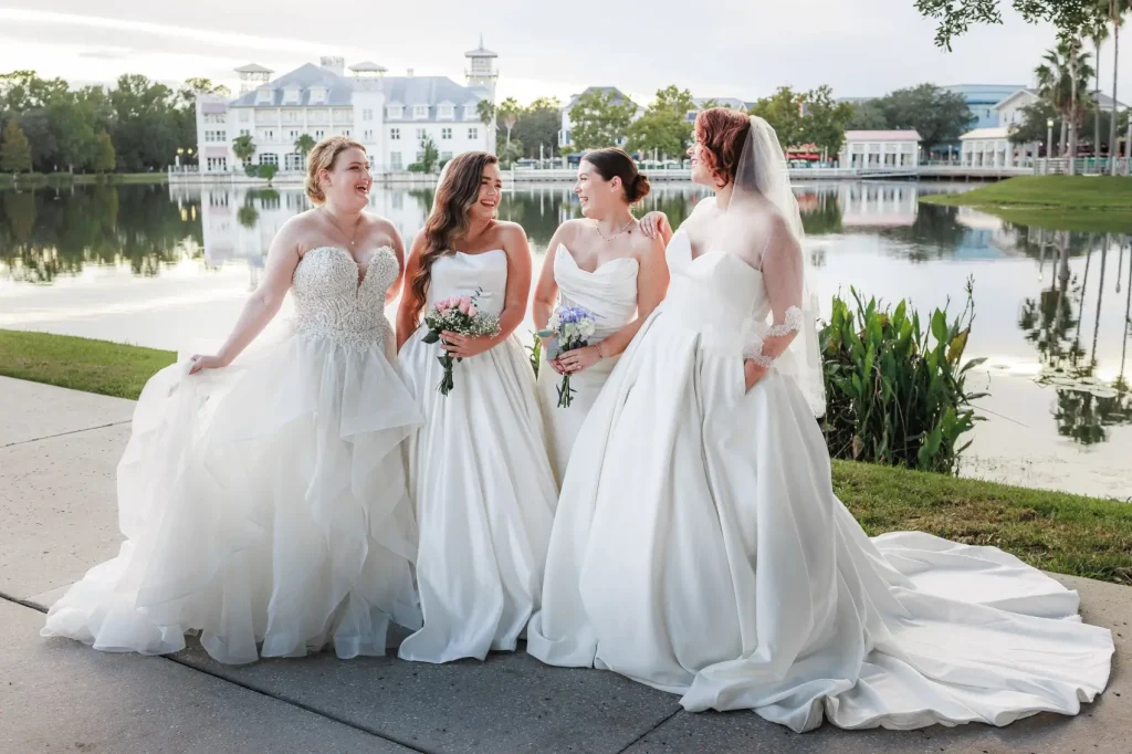 group of four brides outside posing for portrait Celebration bridal boutique