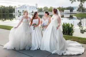 group of four brides outside posing for portrait Celebration bridal boutique