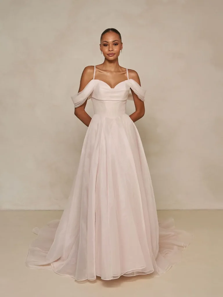 a line wedding dress with drapped off the shoulder sleeves 3D embroidered lace, is artfully structured with a soft micro-plunge neckline