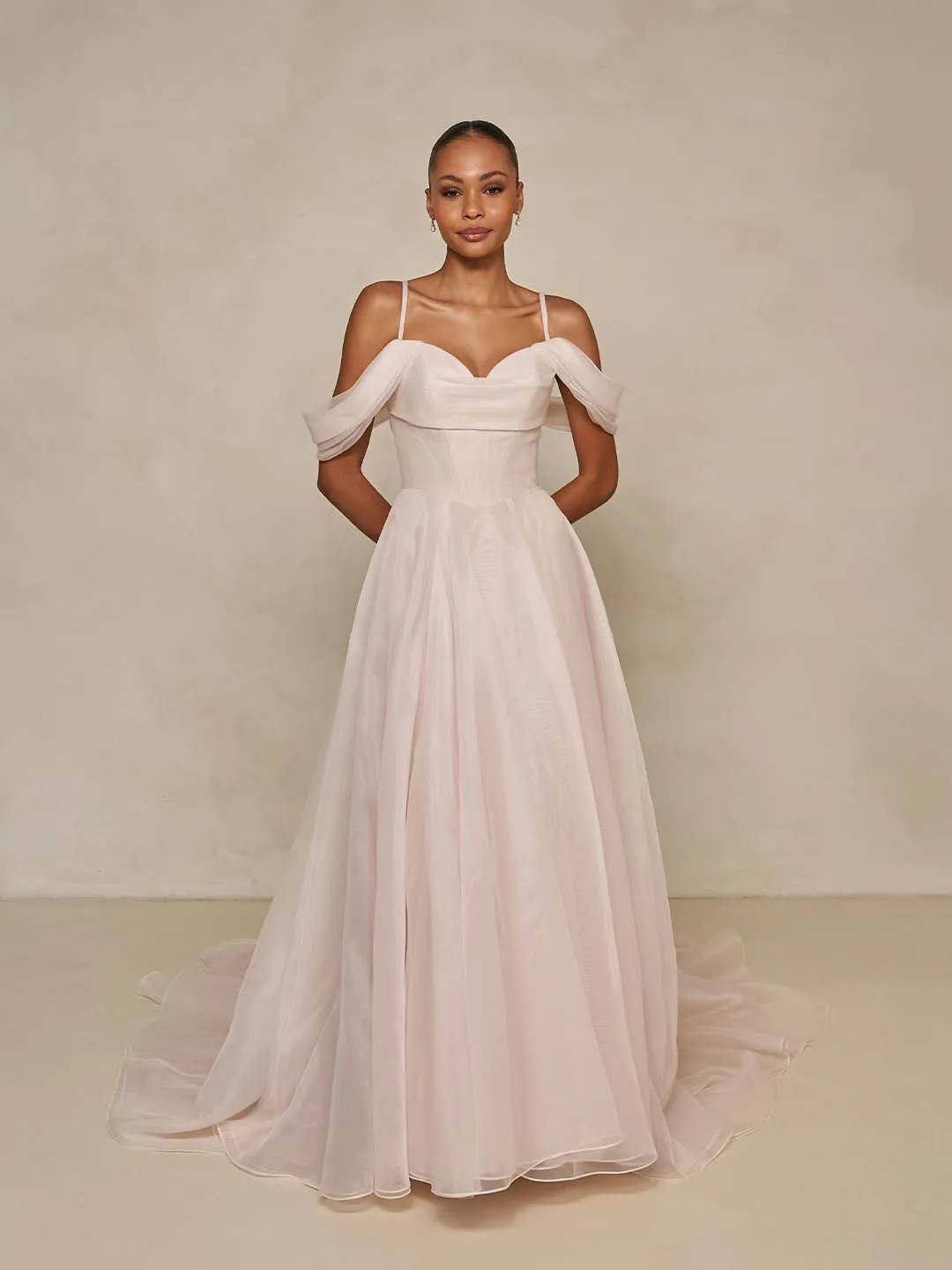a line wedding dress with drapped off the shoulder sleeves 3D embroidered lace, is artfully structured with a soft micro-plunge neckline